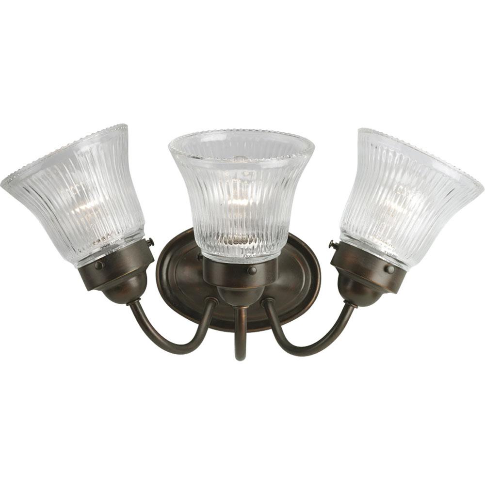Progress Lighting Fluted Glass Collection Three-Light Antique Bronze Clear Prismatic Glass Traditional Bath Vanity Light